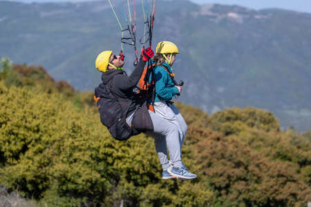 Drama, Greece -  May 5, 2020: Paraglider in the popular area for parachuting on the side of...