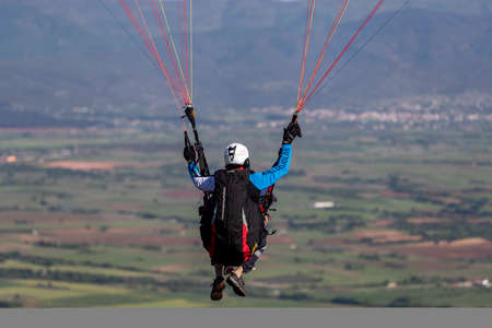Drama, Greece -  May 5, 2020: Paraglider in the popular area for parachuting on the side of Korylovos in Dramaのeditorial素材