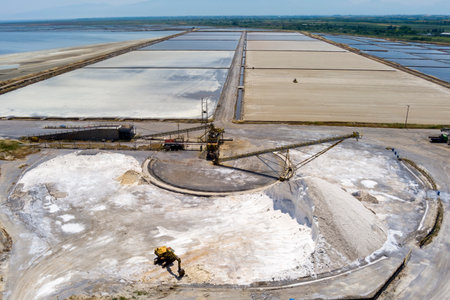Aerial view of salt evaporation ponds and salt mounds these ponds are filled from ocean and salt crystals are harvested. Kitros Pieria, Greeceの写真素材