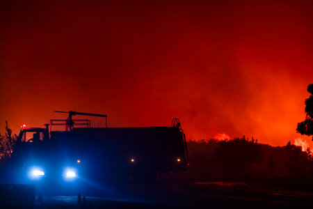 Alexandroupoli - Greece, August 21, 2023: The silhouette of a firetruck. Forest fires in the...