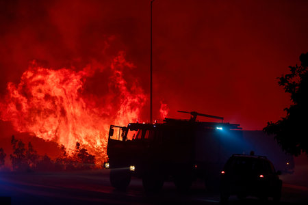 Alexandroupoli - Greece, August 21, 2023: The silhouette of a firetruck. Forest fires in the...