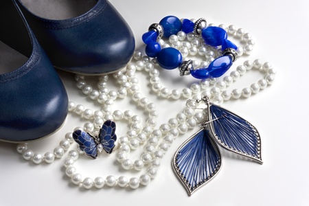 blue accessories: shoes, bracelet, ring, earrings in blue and white pearl necklaceの写真素材
