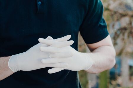 Man wearing gloves for protection from virus