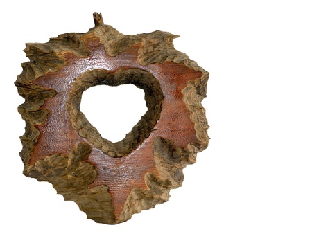  The photo shows the hand-carved wooden heart symbol  Isolated object on a white background の写真素材