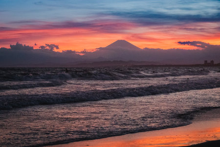 Sunset at the beach with Mount Fuji in the background.の写真素材