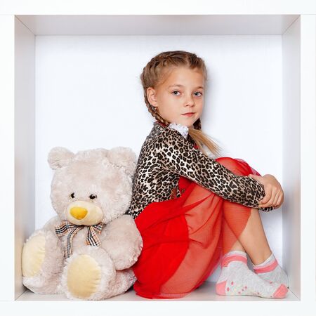 The girl is sitting in a boxの写真素材