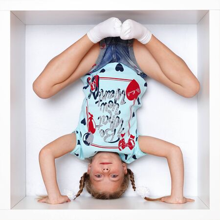 The girl is sitting in a boxの写真素材