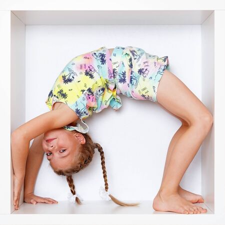 The girl is sitting in a boxの写真素材