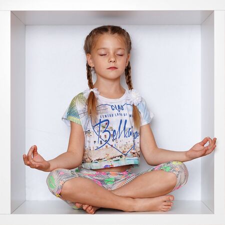 The girl is sitting in a boxの写真素材