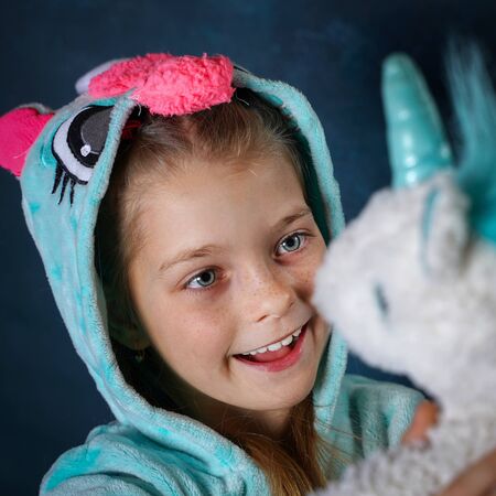 Girl are in pajamas unicornsの写真素材