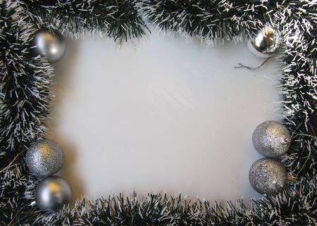 Decorative frame with place for text on white background, greeting cards made from tinsel and christmas balls, Christmas and New Year concept, copy space, top view, flat layの写真素材