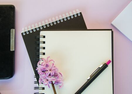 Textbook with empty place for text, copy space, office concept, beautiful blooming pink flower - hyacinthの写真素材