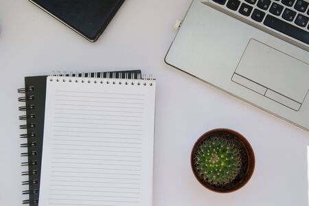 Close up of textbook with blank white page for text, copy space, office concept, different business accessoriesの写真素材