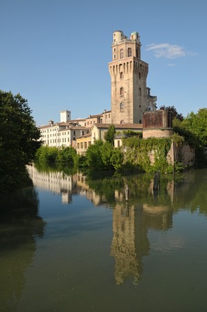 Padua, Italy. Old castle tower named 'Specola' along riverの写真素材