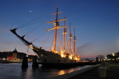 Old sail ship docked. No brands,names,plates readable.