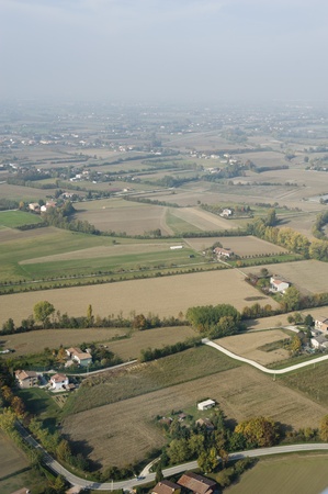 Aerial view of little villages and cultivated fields in Pianura Padana, Italy