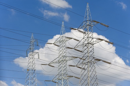 Power lines over blue sky and clouds