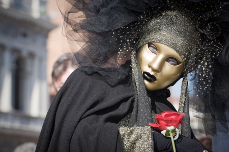Venice, Italy - February 17, 2012: Mask posing in Saint Mark square during famous Venetian Carnival celebrations. Shot in Venice, Italyのeditorial素材