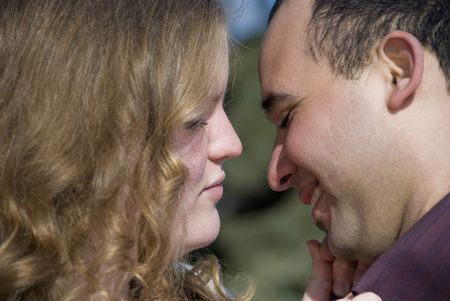 Young Man and Woman About to Kiss