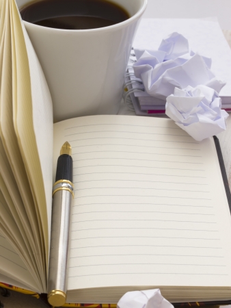 office arrangement with cup of coffeeの写真素材