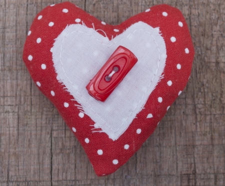 textile heart on the wooden background