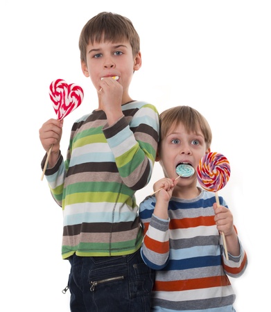 kids with colorful lollipopsの写真素材