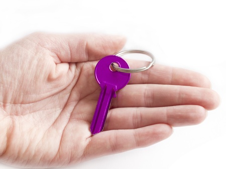 purple key on the handの写真素材