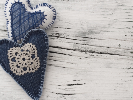textile hearts on the wooden backgroundの写真素材