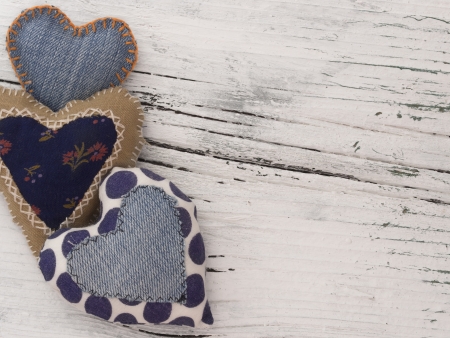 textile hearts on the wooden backgroundの写真素材