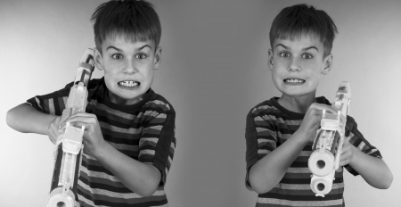 boy with toy gunの写真素材