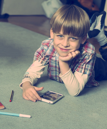 boy taking selfie with smartphoneの写真素材