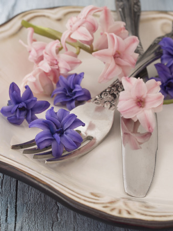 fork and knife with fresh flowers, spring menu arrangementの写真素材