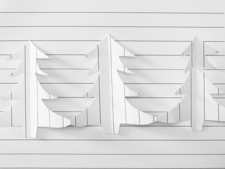 handmade Christmas tree cut out from white paperの写真素材