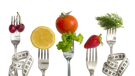 Diet Concept, vegetables and fruit on the forksの写真素材