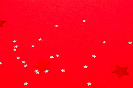 Decorative stars for jewelry on a red background. Banner, postcard form. Copy space, flat lay. New...