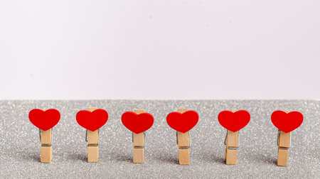 Clothespin with red heart for Valentine's Day on grey