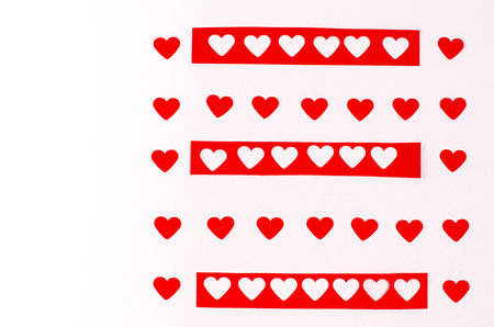 Pattern of red romantic hearts on white