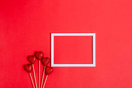 Blank craft postcard for congratulations with a shiny heart on a white background. Love concept, copy space, flat lay, place for text, banner, top view.の写真素材