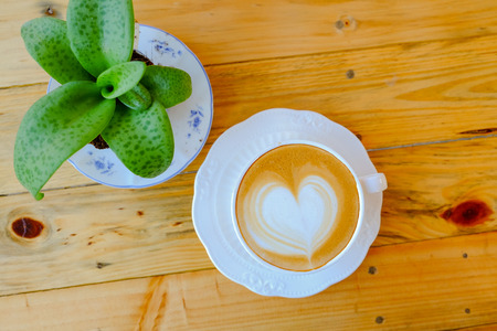 coffee latte art on wood tableの写真素材