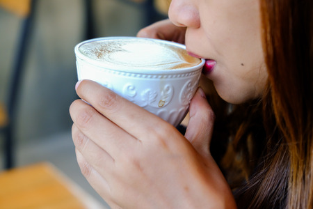 coffee latte art on womenの写真素材