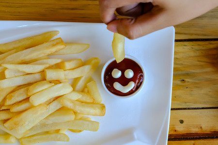 french fried Chicken sauce smile on handの写真素材