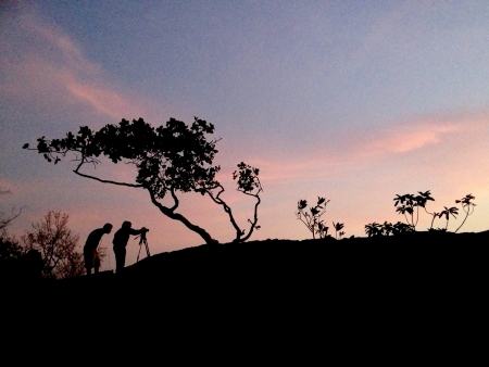 2 mens shooting the sunriseの写真素材