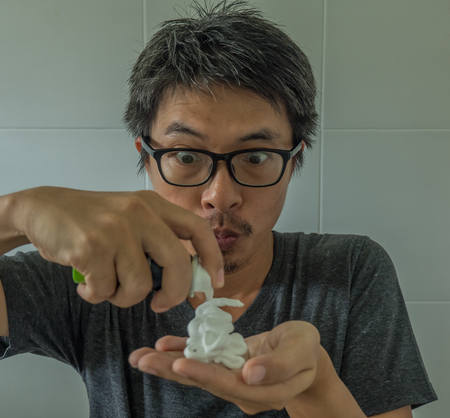 Portrait Of Man Trimming His Beardの写真素材