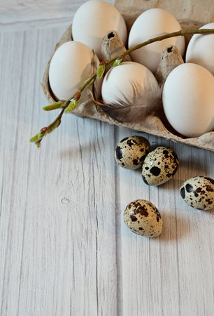 Heap of quail eggs decorated with feather. organic food. rustic style. top view.