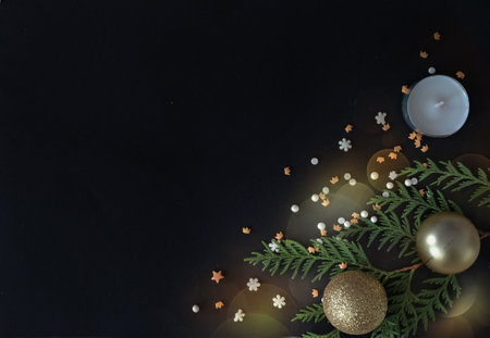 Christmas or New Year dark background, Xmas black board framed with season decorations, space for a text, view from above.の写真素材