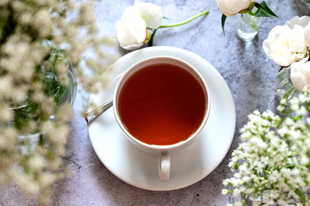 Fresh white gypsophila, piones on a white background. Wedding date. An invitation to a holiday. Congratulation.An empty space for text. View from above.の写真素材