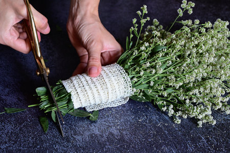 Florist at work. How to make gypsophila paniculata wedding wreath, step by step, tutorial.