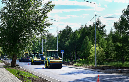 Large view on the road rollers working on the new road construction site
