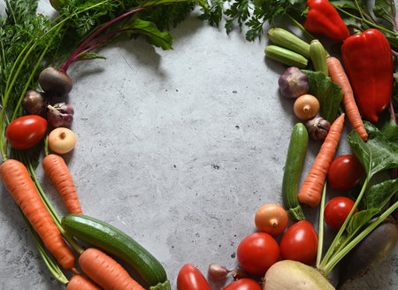 food cooking background. Fresh rosemary, cilantro, basil, cherry tomatoes, peppers and olive oil, spices herbs and vegetables at black slate table. Food ingredients top view.の写真素材