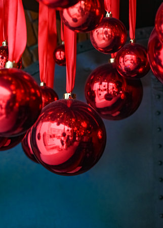 Red Christmas balls on ribbons. Decoration for the street for the New Yearの写真素材